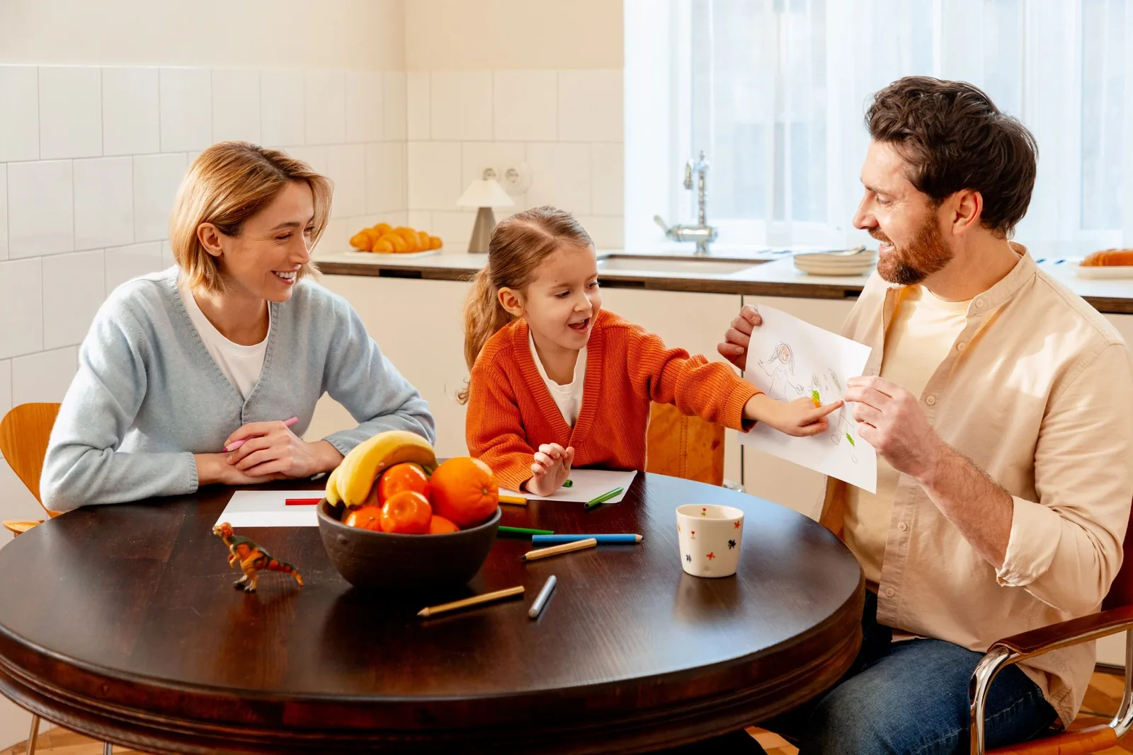 Family playing together at the kitchen table