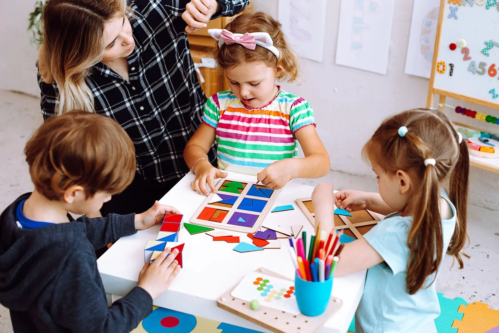 Teacher and children exploring shapes